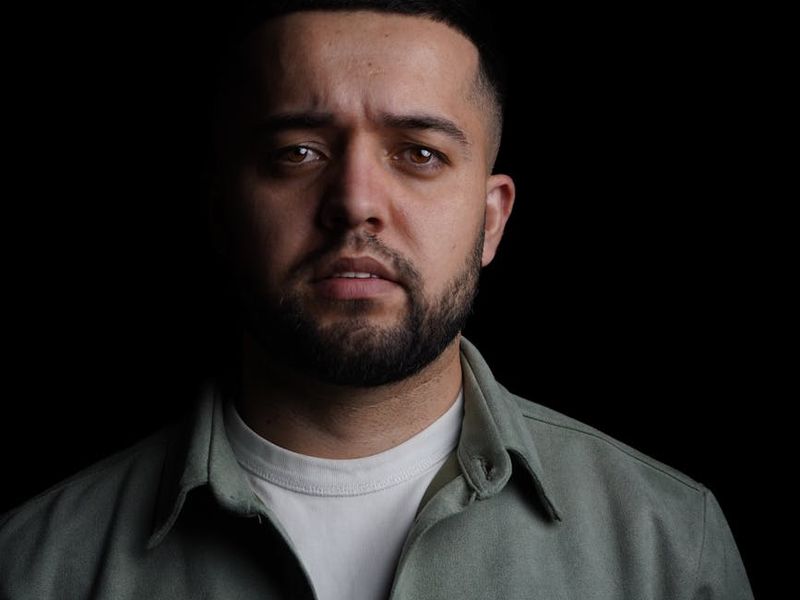 A large central image of a man in a powerful, static pose.