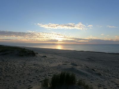 A smaller image showing a detail of a balance exercise.